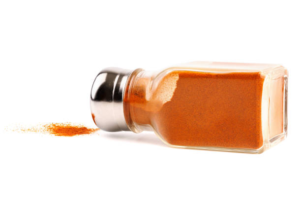 istock glass pepper pot with ground red pepper dropped on its side isolated on white background 1400651352
