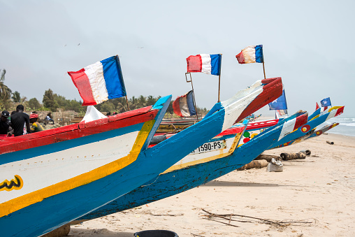 Sanyang, The Gambia - May 08, 2017: Fishing boats stranded on the beach