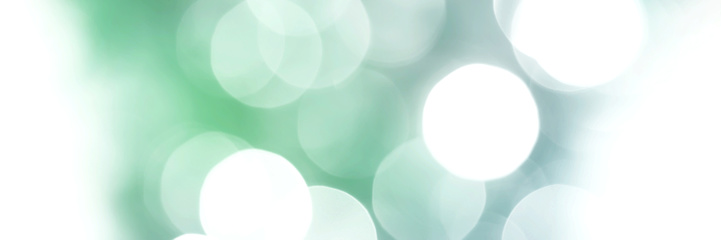 Summer green and blue sparkling glitter bokeh background, banner texture. Abstract defocused lights header. Wide screen wallpaper. Panoramic web banner with copy space for design
