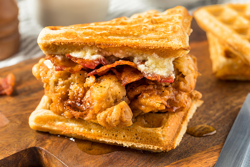 Homemade Chicken and Waffle Sandwich with Bacon and Syrup
