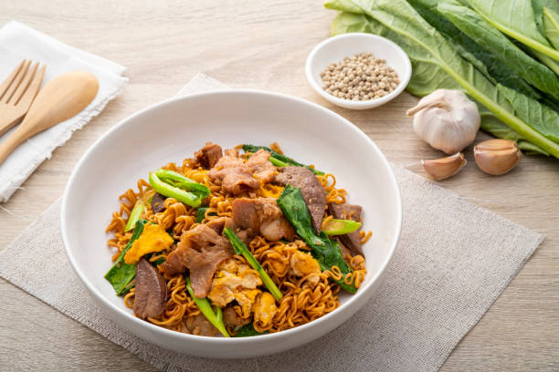istock Stir-fried Instant Noodles with Soy Sauce and Pork 1400659248