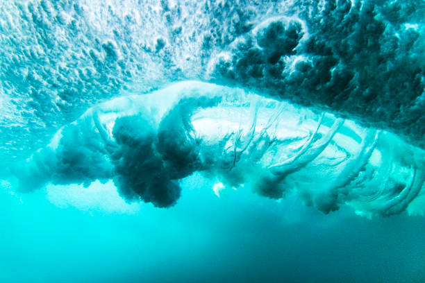 istock View beneath a breaking wave in the ocean as air spirals into veins 1400661558