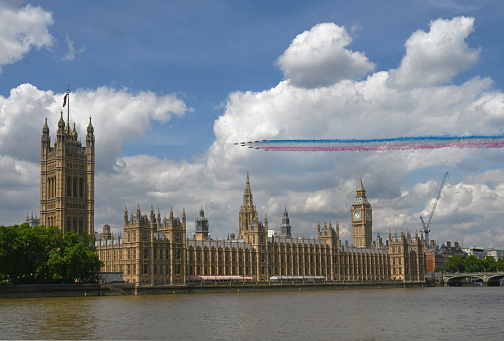 The Platinum Jubilee flypast, Royal Air Force Red Arrow jets streak patriotic colours over the House of Parliament in London, UK