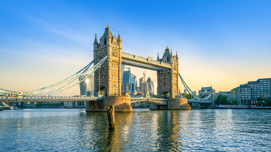 London Bridge Over Thames River Against Cloudy Sky