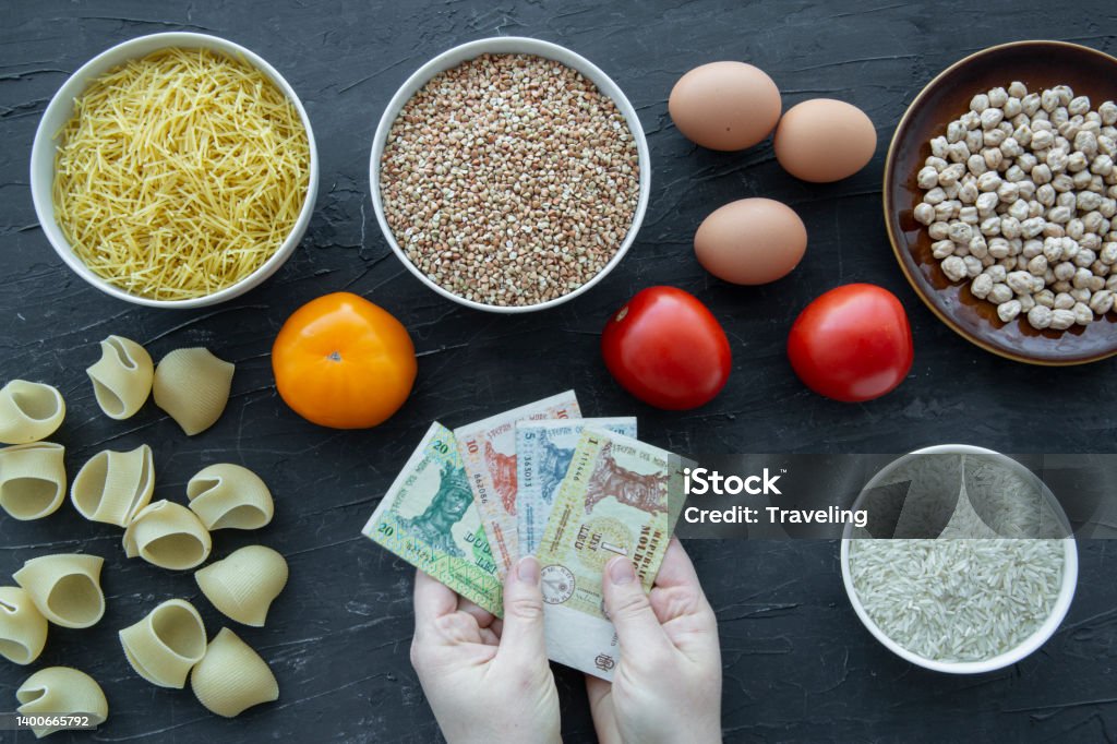 Concept of high costs of every day products in Moldova. Leu currency and food. Concept of high costs of every day products in Moldova. Leu currency and popular every day products. Breakfast Cereal Stock Photo