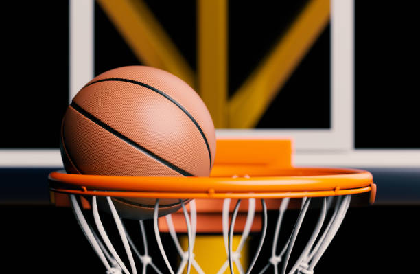 istock Basketball ball in the hoop. Close shot 3d render, focused image. 1400666608