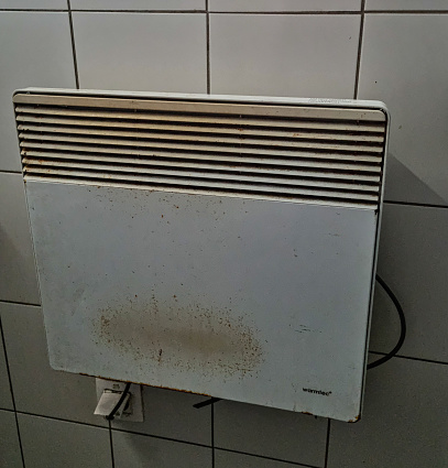 Old dirty broken heater, radiators