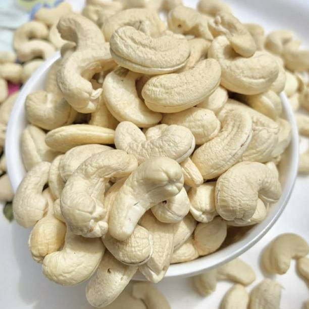 istock Cashew nuts in white bowl on table. 1400668685