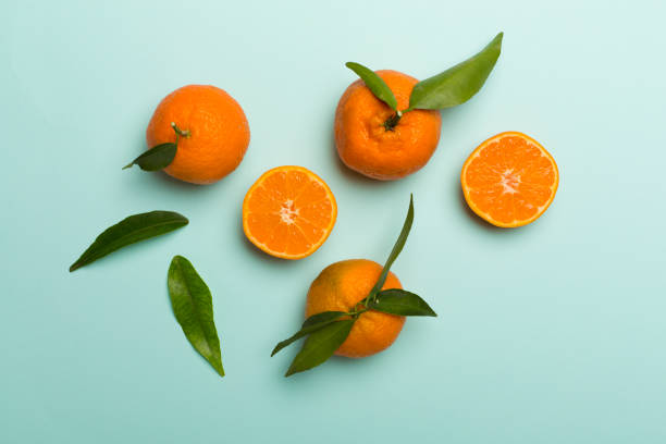 istock Flat lay with fresh mandarines on color background. Top view 1400669250