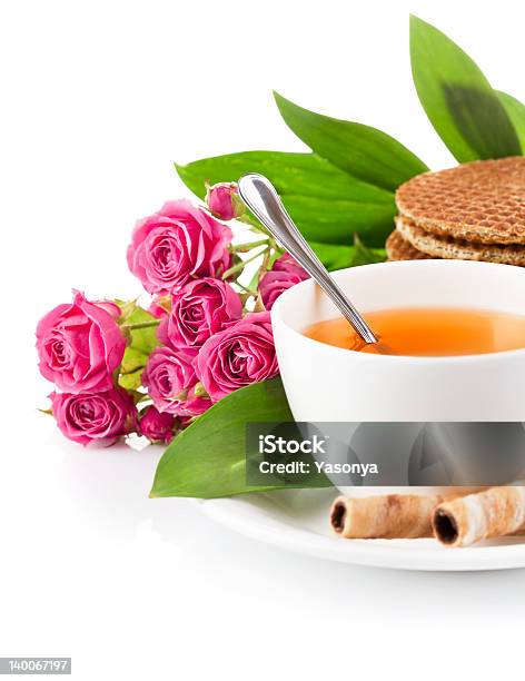 Tea In Cup With Biscuits And Bouquet Roses Stock Photo - Download Image Now - Bouquet, Candy, Cookie