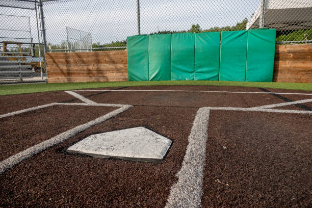 istock Angled view of a large, empty baseball field on a bright, sunny day 1400674233
