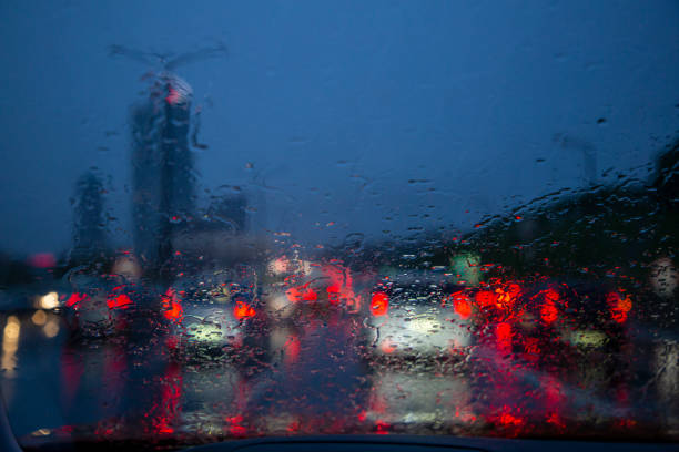istock Car point of view driving along rainy highway 1400676777