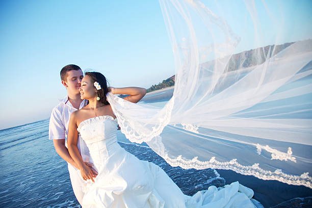 istock Newlyweds on the beach at sunset 140067860