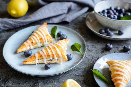 Juicy Blueberry puff pastry Turnovers with lemon glaze