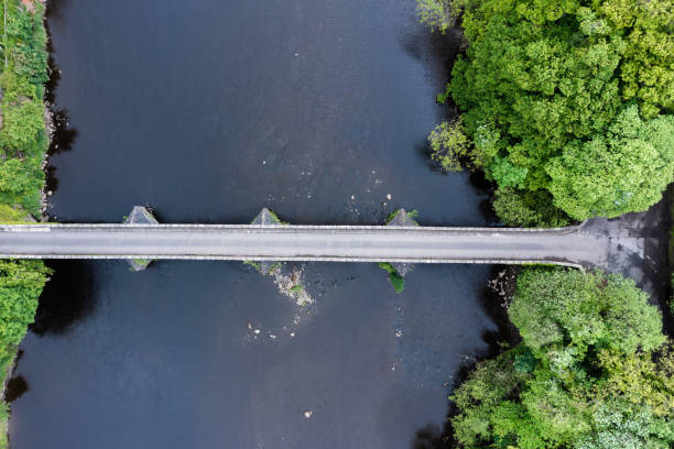 istock Aerial view of an old stone bridge crossing a river 1400681448