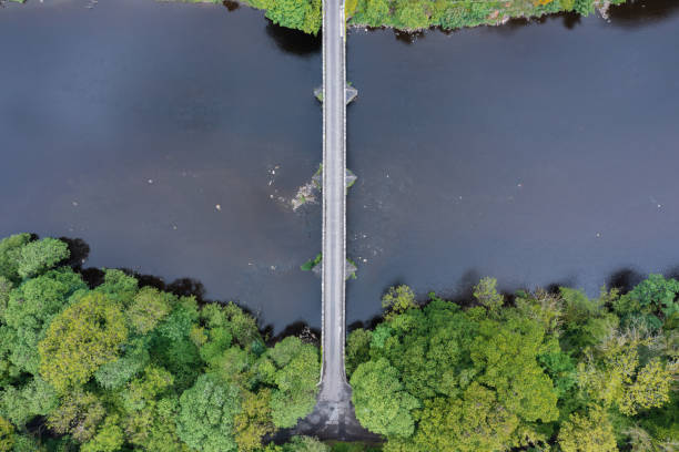 istock Drone view of an old stone bridge crossing a river 1400681492