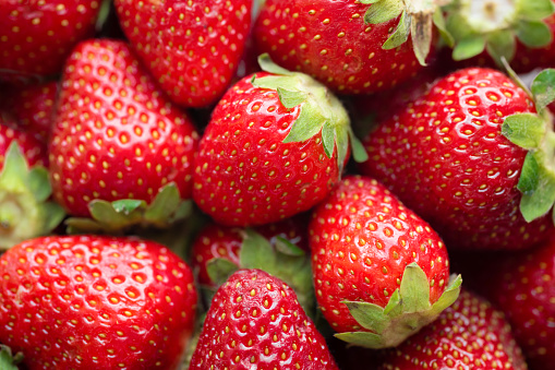 Strawberry background. Freshly picked ripe strawberries. Fruit background, Fresh organic berries.