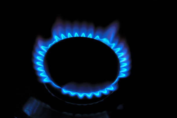 istock gas burner with burning gas. dark background. 1400682501