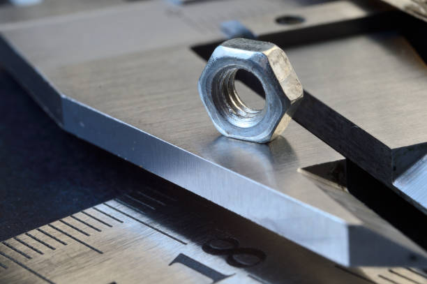 istock Accurate measuring tool caliper and metal ruler lie in place with nuts. close-up 1400682630