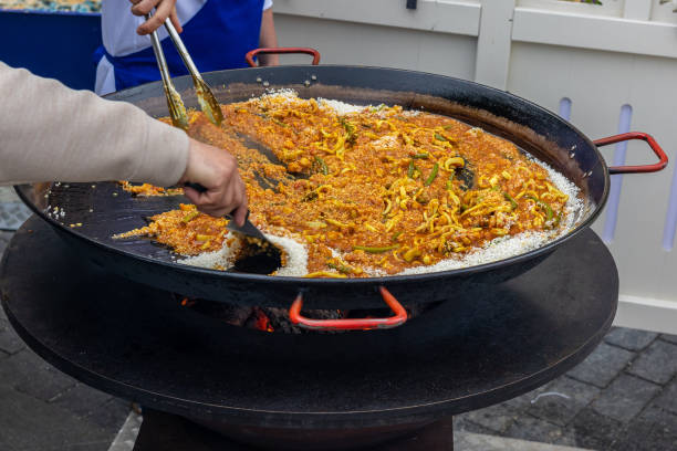 istock Cooking pasta in a huge frying pan on the grill 1400683556