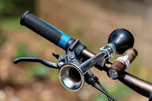 Close-up bicycle handlebar with equipments.