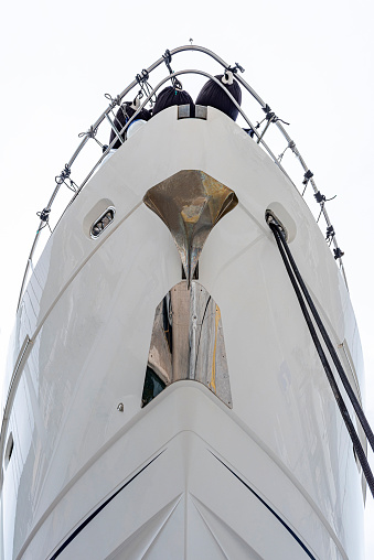 Antifouling paint applied to the hull of a motor yacht pulled ashore for maintenance. Seasonal mending.