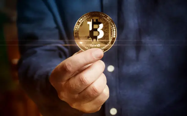 Photo of Bitcoin BTC cryptocurrency golden coin 3d illustration