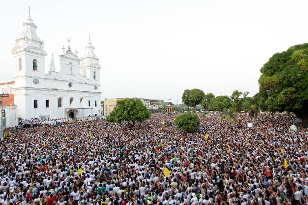 Crowd at Sé Cathedral during Círio de Nazaré 2011 Crowd of people gathered in front of Sé Cathedral for the festivity of Círio de Nazaré, the largest Marian procession of the world, which happens every October in Belém, Pará, Amazon, Brazil. 2011. cirio de nazare stock pictures, royalty-free photos & images