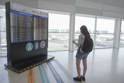 Campinas, Sao Paulo, Brazil - May 11, 2022: Passenger Checking the Flight Boarding.