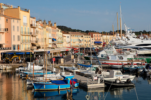 Boats arrives into Saint Tropez Harbor, one of the most famous places in the world located on French Riviera, Cote d'Azur, Mediterranean Sea, Saint Tropez was made famous by Brigitte Bardot in the 1960s, it is a playground for actors, models, millionaires and jetsetters.