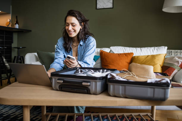 Woman using laptop to book travel reservation