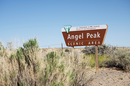 Bloomfield, New Mexico, USA - May 13, 2022: Sign for Angel Peak Scenic Area on  Highway 550 near Bloomfield, New Mexico.