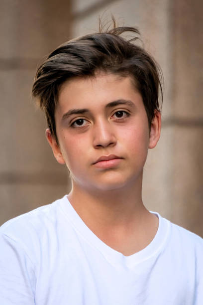 istock Serious teenage boy looking at the camera 1400703736