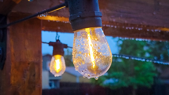 String lights covered in raindrops