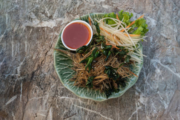 istock Deep fried horseface loach fish fried or Crispy fried Banana-root fishes. 1400713056