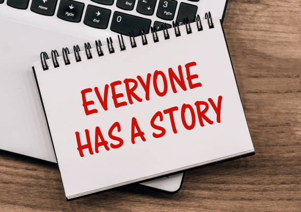 istock Everyone Has A Story text on notepad lying on a laptop on wooden table. 1400713106