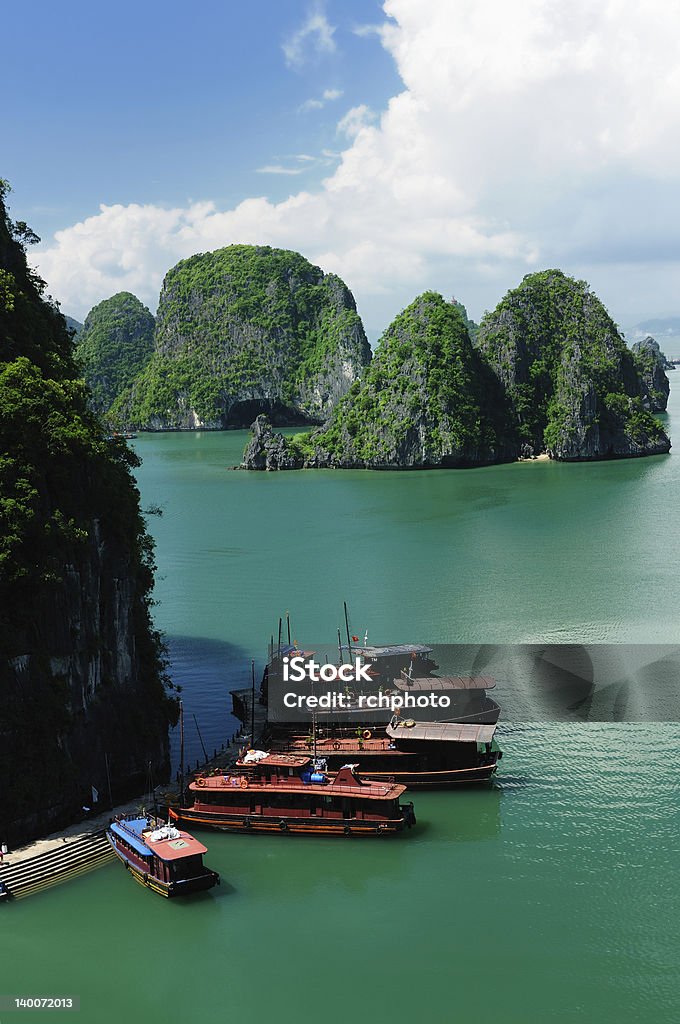 Wooden boats in Halong Bay in Vietnam Vietnam - Halong Bay National Park (UNESCO). The most popular place in Vietnam. Hạ Long Bay Stock Photo