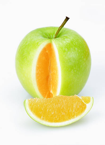 apple ou cor de laranja - apple fruit surreal bizarre imagens e fotografias de stock