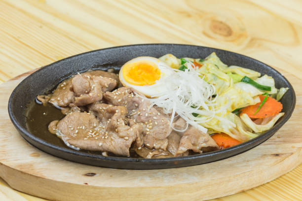 istock sliced pork steak on hot plate - Asian style 1400727512