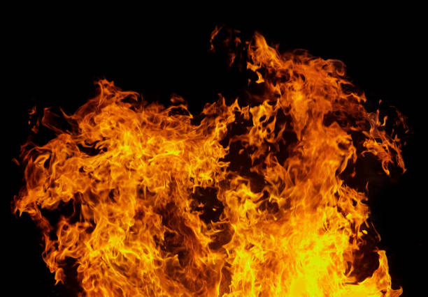 istock Close up burning flames on black background for graphic design or wallpaper 1400727542