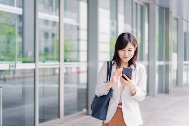 istock Young businesswoman checking her phone 1400729408