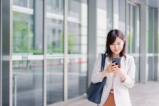 istock Young businesswoman checking her phone 1400729410