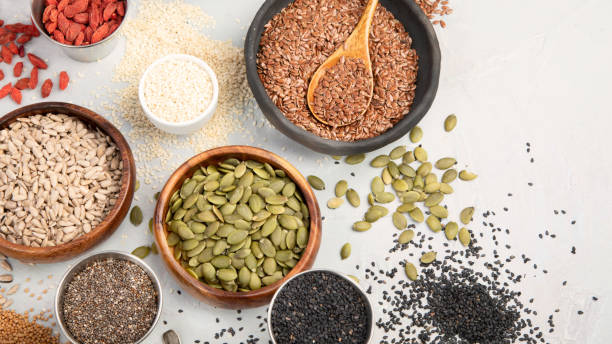istock Variety of edible seeds on light background. 1400729547
