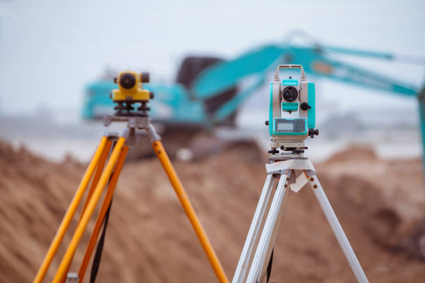 istock Theodolite survey engineer equipment to measurement positioning on the construction site of the road with construct machinery background. 1400732579