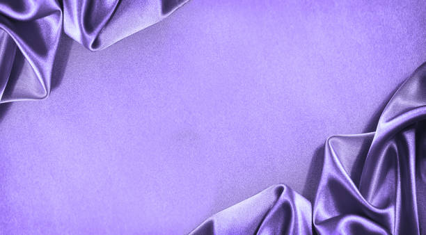 Beautiful purple pink silk satin background. Soft folds. Shiny fabric. Luxury lilac background with copy space for design. Web banner. Beautiful purple pink silk satin background. Soft folds. Shiny fabric. Luxury lilac background with copy space for design. Web banner. Flat lay, top view. Birthday, wedding, Christmas, Valentine. light blue silk stock pictures, royalty-free photos & images