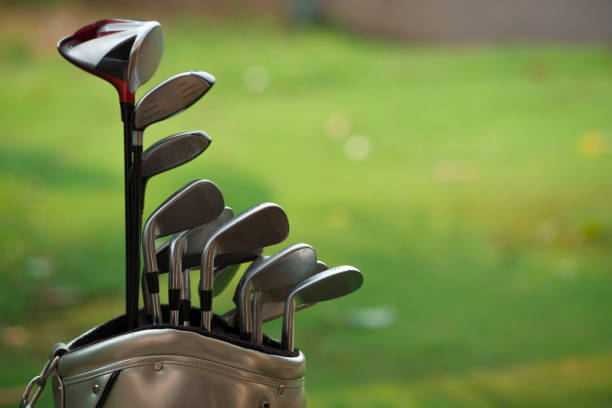 istock Closeup old golf bags on green. 1400734375