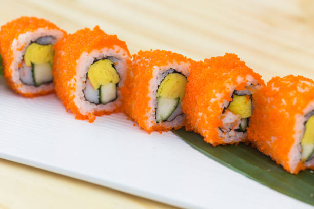 istock Traditional fresh japanese sushi rolls isolated on white background. Top view 1400734445