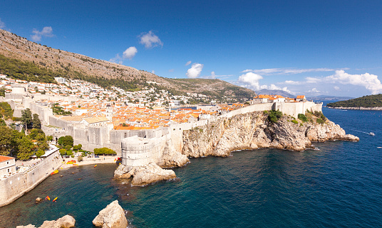 The ancient walls of the Croatian city of Dubrovnik. Dubrovnik is one of the most prominent tourist destinations in the Mediterranean Sea, a seaport and the centre of Dubrovnik-Neretva County. Situated in an exclave, it is connected to the rest of the country by the Pelješac Bridge. In 1979, the city of Dubrovnik was added to the UNESCO list of World Heritage Sites in recognition of its outstanding medieval architecture and fortified old town.