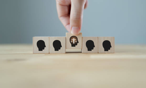 istock Personal ethics concept. Ethical mindset. Business integrity and moral. Selecting wooden cubes with ethical person. Hiring, recruitment, promoted employee. Company culture and sustainable success. 1400743435