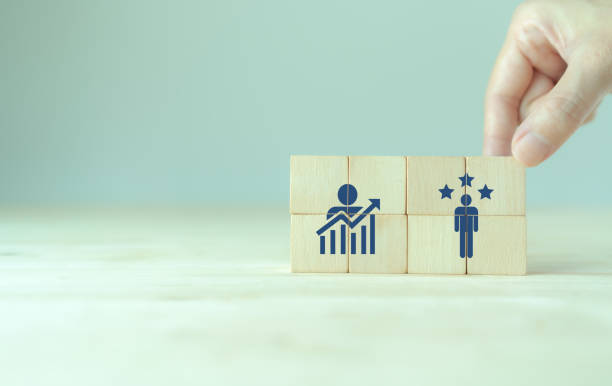 istock Personal development, growth mindset and promoted employee. Human resource management and training. Enhancing competency, self learning, experience. Wooden cubes with improvement and promoted icons. 1400743470